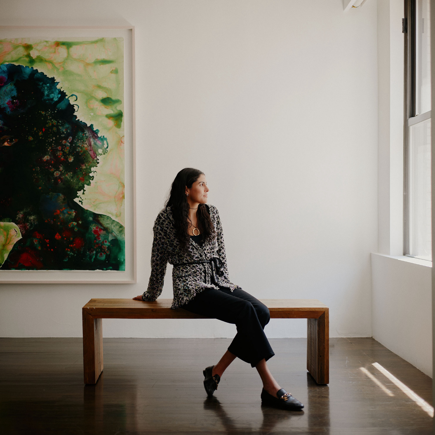 woman on bench in gallery