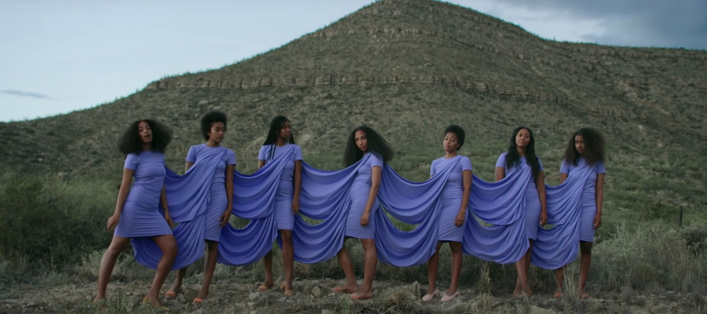 solange with six dancers wearing connected dress in mountain setting