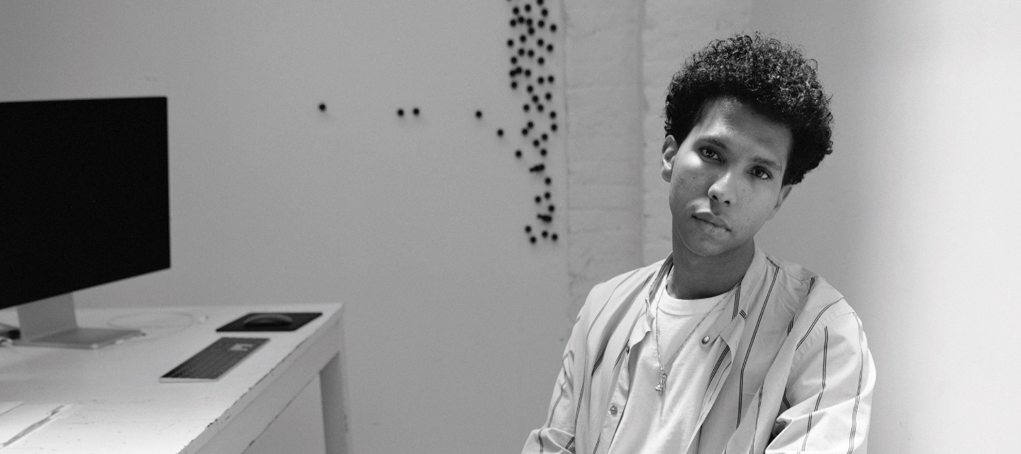 A man sitting in a studio.